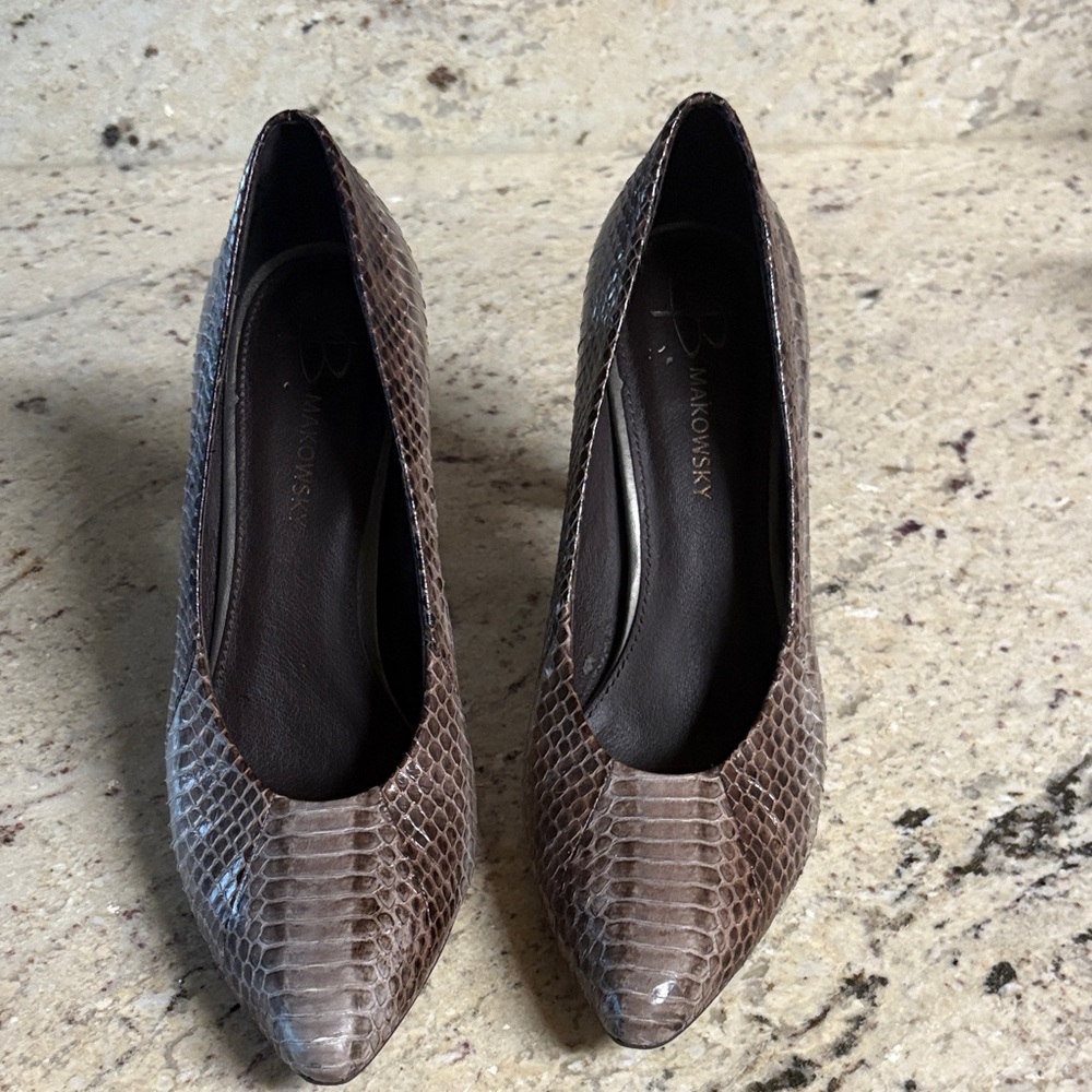 These leather heels are 4 inches are in very good condition. They are size 8.